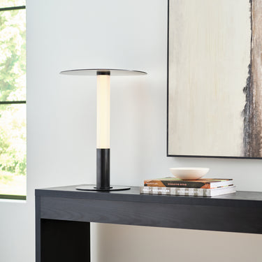 Detailed view of Miguel bronze portable lamp's etched glass shade and reflective plate design.