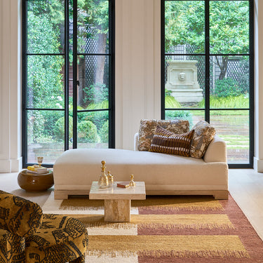 Cala jute rug in Gold, styled in a room