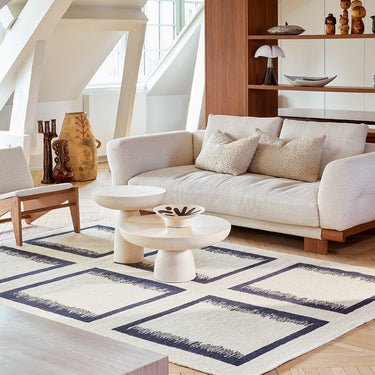 Ciutadella jute rug in Blue, styled in a room