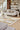 Ciutadella jute rug in Gold, styled in a room