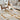 Ciutadella jute rug in Gold, styled in a room