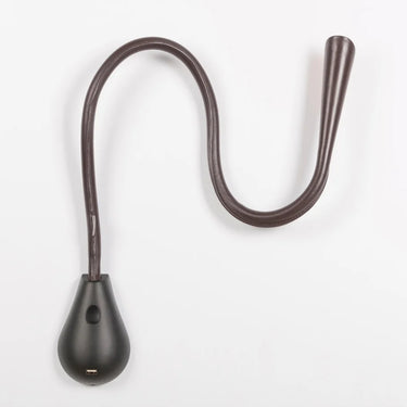 Close-up of Cobra LED wall lamp with brown leather flexible stem and gold inner hood, perfect for bedside reading.