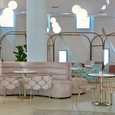 Coco opal glass globes hung in a restaurant dining room | Besa Lighting