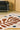 Coral wool rug in Ocre, full view