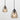 Contemporary clear glass pendant light illuminating a modern living room space.