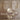 Two Modulo wall lights with smoked glass plates beside oval mirrors above a marble vanity in a bathroom