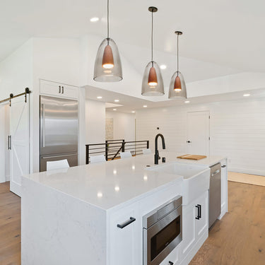Three Dano pendants in a modern white kitchen | Besa Lighting