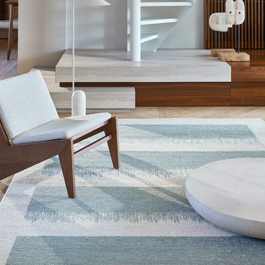 Figueras jute rug in Aqua, styled in a room