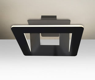 Matrix glowing against the ceiling, light reflected from the frosted face | Besa Lighting