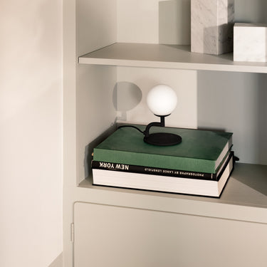 Globe table lamp, Black and Opal, styled in a room | Mobil by Pholc