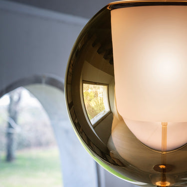 Close detail of the Penta Glo floor lamp glass sphere and its reflections
