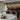 Penta Lit pendant lights hanging over a table