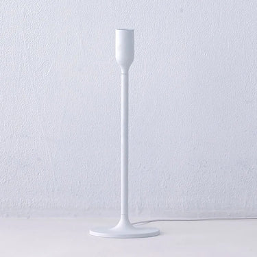 Close-up of the minimalist Innermost Yoy LED desk lamp, showcasing its unique light projection effect.