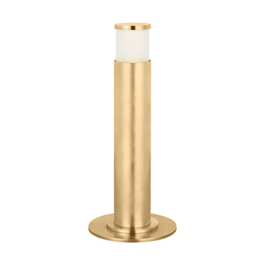 Rechargeable antique brass table lamp, Miguel 10", casting indirect light on desk.