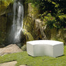 White Arc curved bench on a lawn in front of a rock wall and waterfall