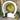 White Pod circle lounge on a stone terrace with a throw, a tufted red pillow and a fruit basket beside it