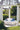 Round Sun Pad topped with a Stack drum as a circular seating group inside a garden gazebo