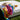 Striped terrycloth topper draped over a white Crib Queen resort bed on the lawn