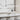 Visual Comfort Langston linear LED chandelier over kitchen island in luxury home interior