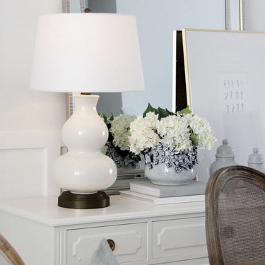 Marilyn Ivory on Black Cordless Lamp by Modern Lantern on a wooden table