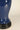 Close-up of midnight blue glazed ceramic and black base on Elijah table lamp