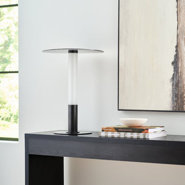 Stylish bronze finish Miguel cordless lamp illuminating a modern living room, soft glow.
