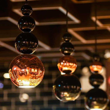 GU10 LED ceiling pendant with abstract sculptural form and ambient light effect
