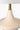 Oliver Cordless Table Lamp Antique Brass illuminating a living room