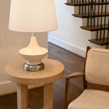 Oliver Ivory Cordless Table Lamp Brushed Nickel illuminating a living room