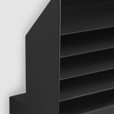 Contemporary outdoor LED wall sconce by Kelly Wearstler with soft indirect light and black aluminum body