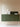 Elise table lamp by Pablo beside a green cabinet