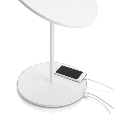 Circa table lamp by Pablo with a phone connected