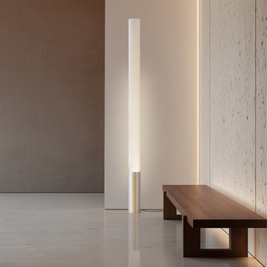 Elise floor lamp by Pablo beside a walnut bench