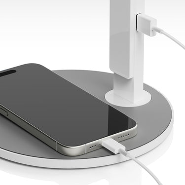 Lim360 desk lamp by Pablo with a phone charging