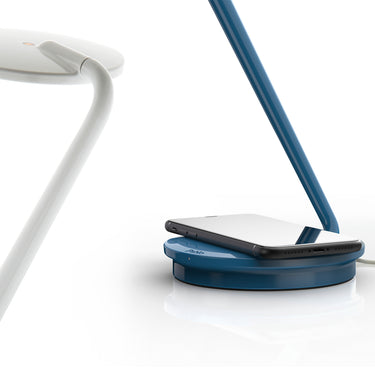 Pixo Plus desk lamp by Pablo, phone charging on the base