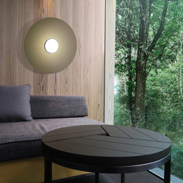 Sky Dome metal flush mount by Pablo against a wood wall