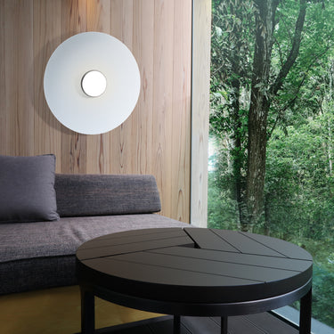Sky Dome white metal flush mount by Pablo against a wood wall