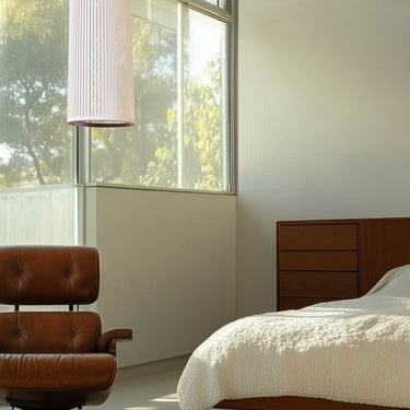 Solis Flush by Pablo with a brown Eames chair