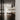 Solis Flush in black by Pablo in a bookcase hallway