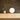 16 inch Bola Sphere table lamp by Pablo on an oak cabinet