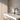 Totem Mini up/down pendant in etched smoke by Pablo in an oak kitchen