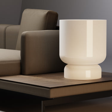 Totem Table lamp by Pablo beside a corner sofa
