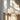 Totem Table Mini white lamp by Pablo on an oak cabinet