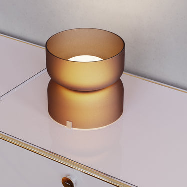Totem Table Mini amber lamp by Pablo above a credenza