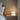 Totem Table Mini white lamp by Pablo on an oak bedside table