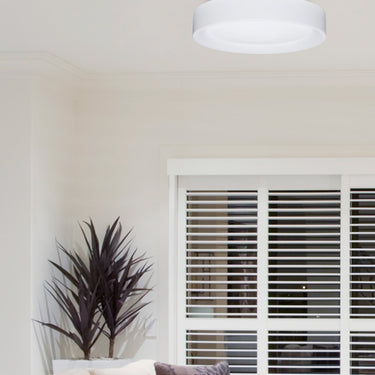 Pella 16 ceiling light in a calm white living room | Besa Lighting