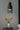 Barro Oaxacan clay pendant light with warm glow, editorial photograph