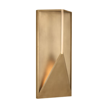 IP65 wet-rated Punto 22 LED wall sconce mounted on an outdoor patio wall, providing functional and decorative exterior lighting in natural brass.