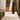 Sabbia wool rug in White, styled in a room