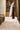 Sabbia wool rug in White, styled in a room